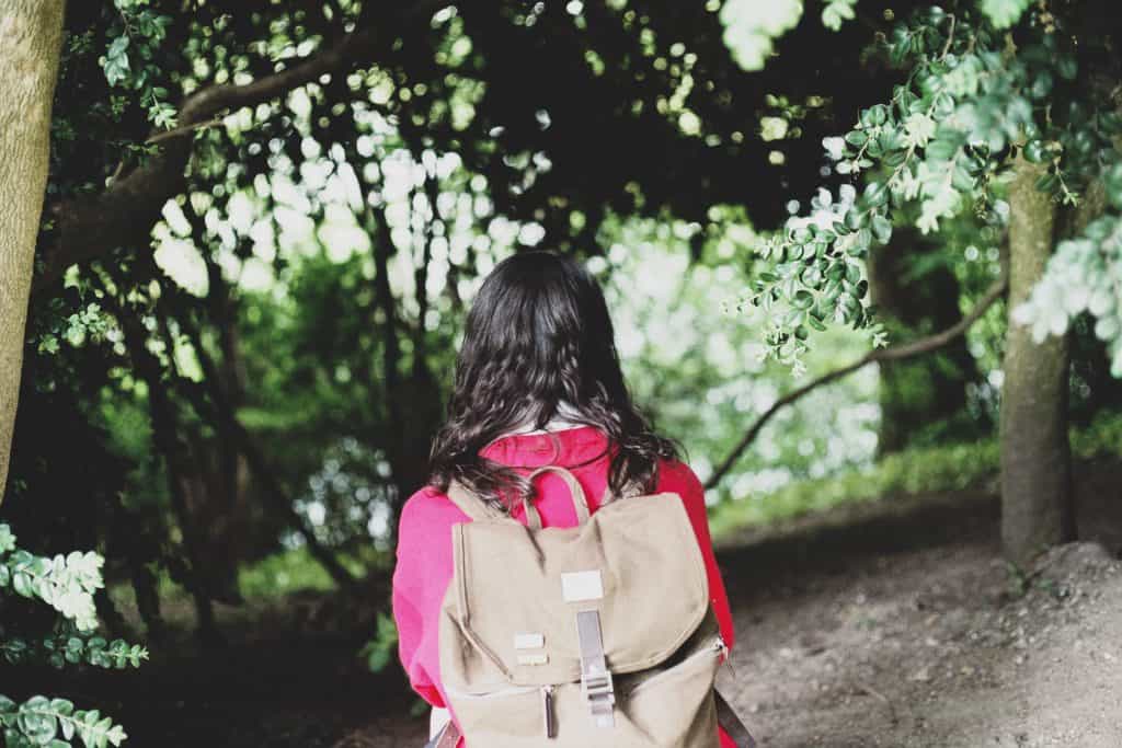 Photo by Florencia Viadana woman wearing brown backpack
